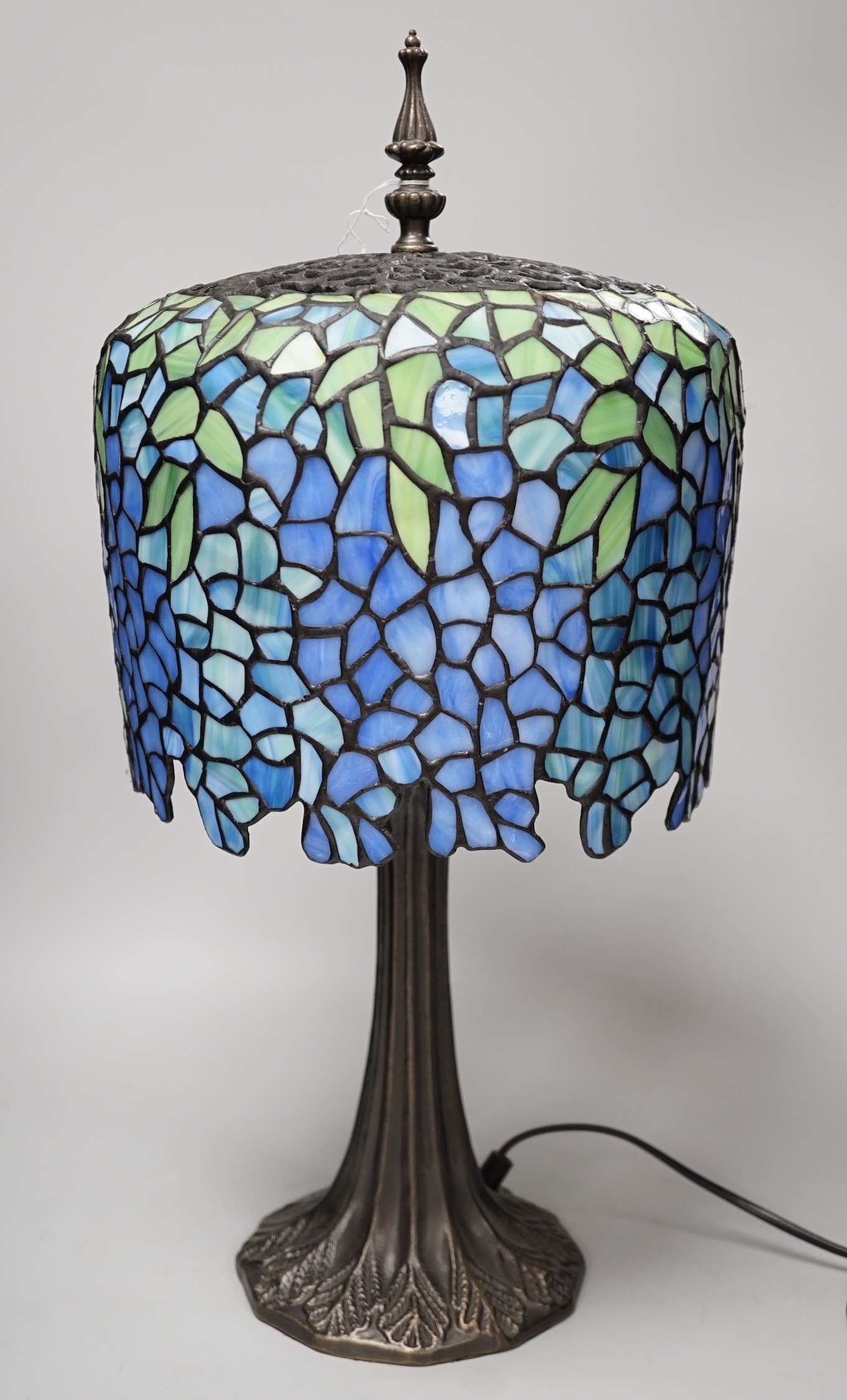 A Tiffany style stained glass lamp. 54cm tall
